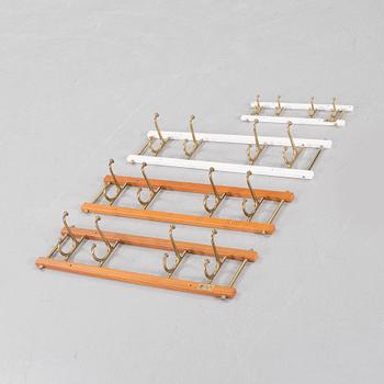 Four circa mid 20th century clothes hangers, "Dekorativ" by Skoglunds metallgjuteri.