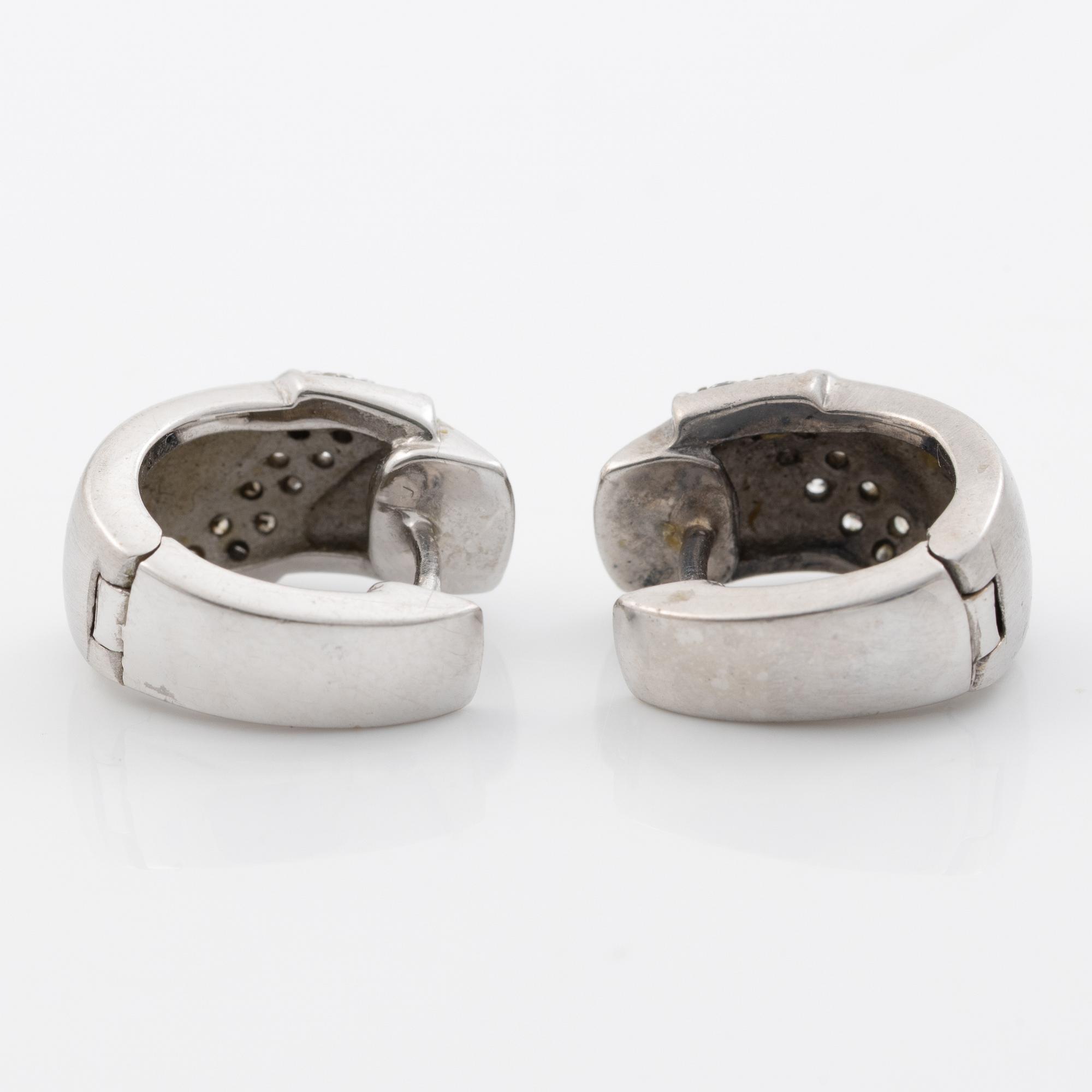 18K white gold earrings with small brilliant-cut diamonds.