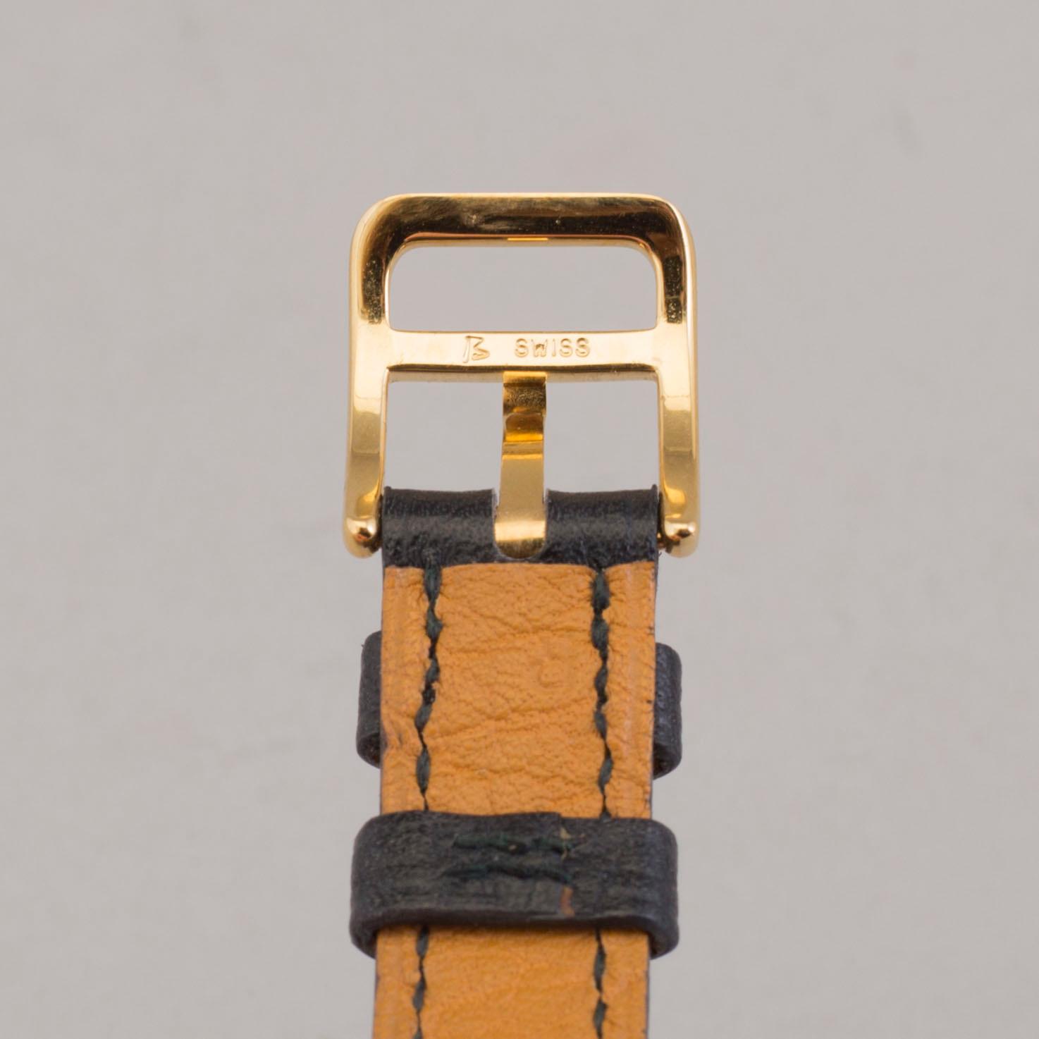 A watch "Kelly Lock" by Hermès.