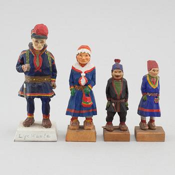 Four wood figurines, by Bengt Fransson among others, one dated -51.