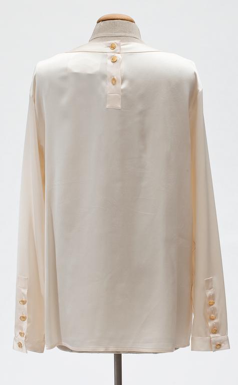 A Chanel silk blouse.