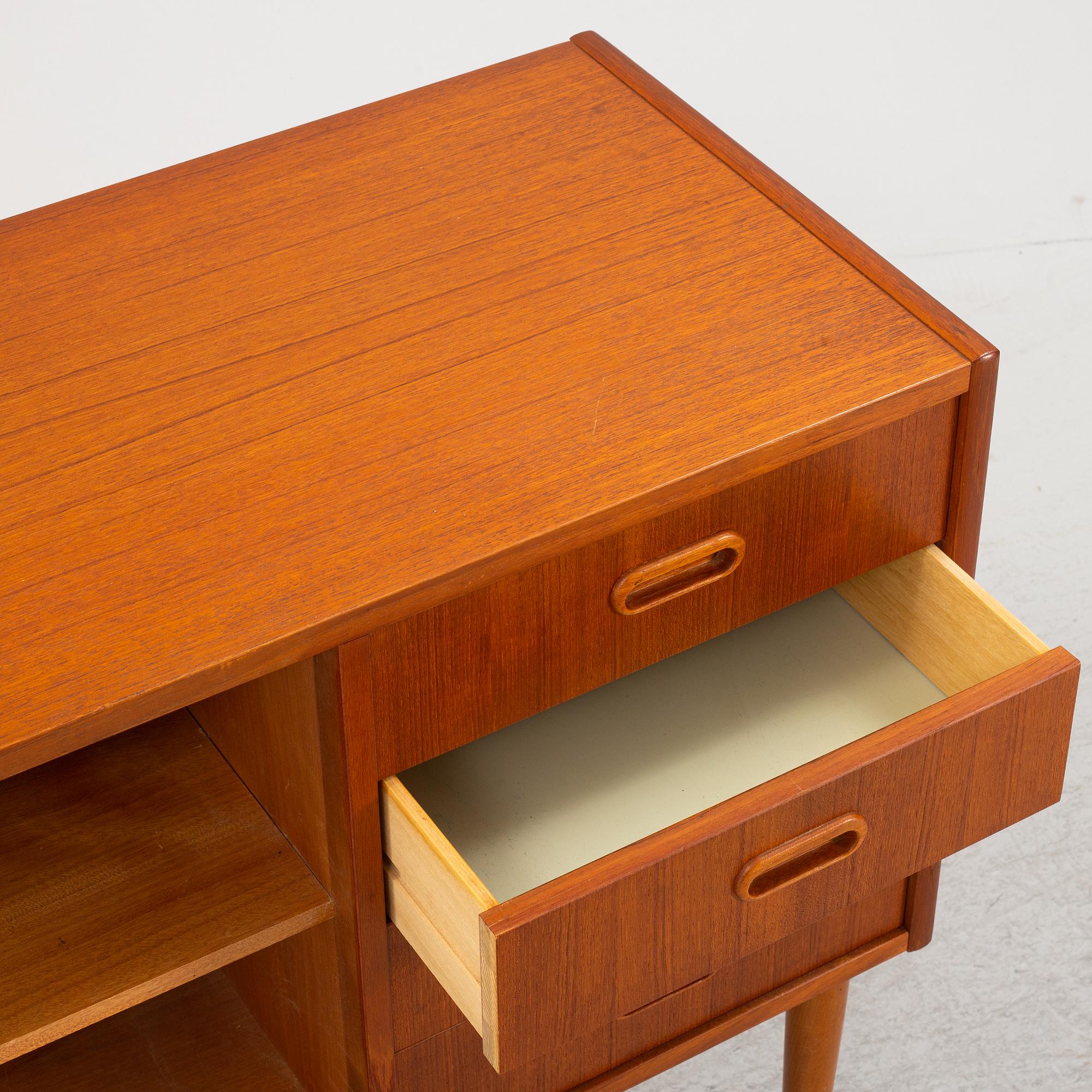 A 1950's teak veneered sideboard.