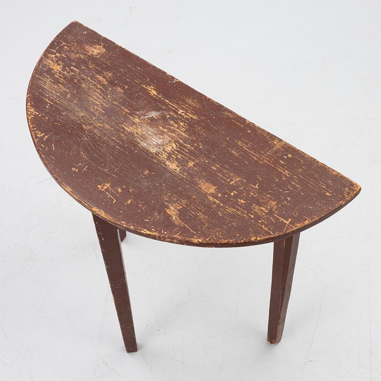 A 'half-moon table', 19th century.