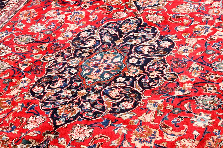 A Meshad rug, signed, 335 x 245 cm.