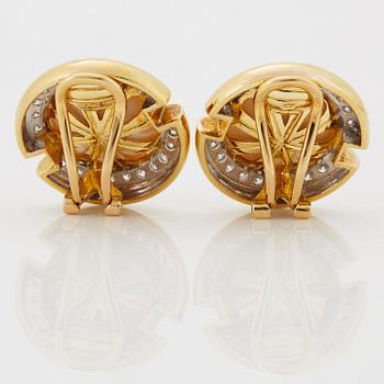 A pair of 18K gold and mabe pearl earrings set with round brilliant-cut diamonds.