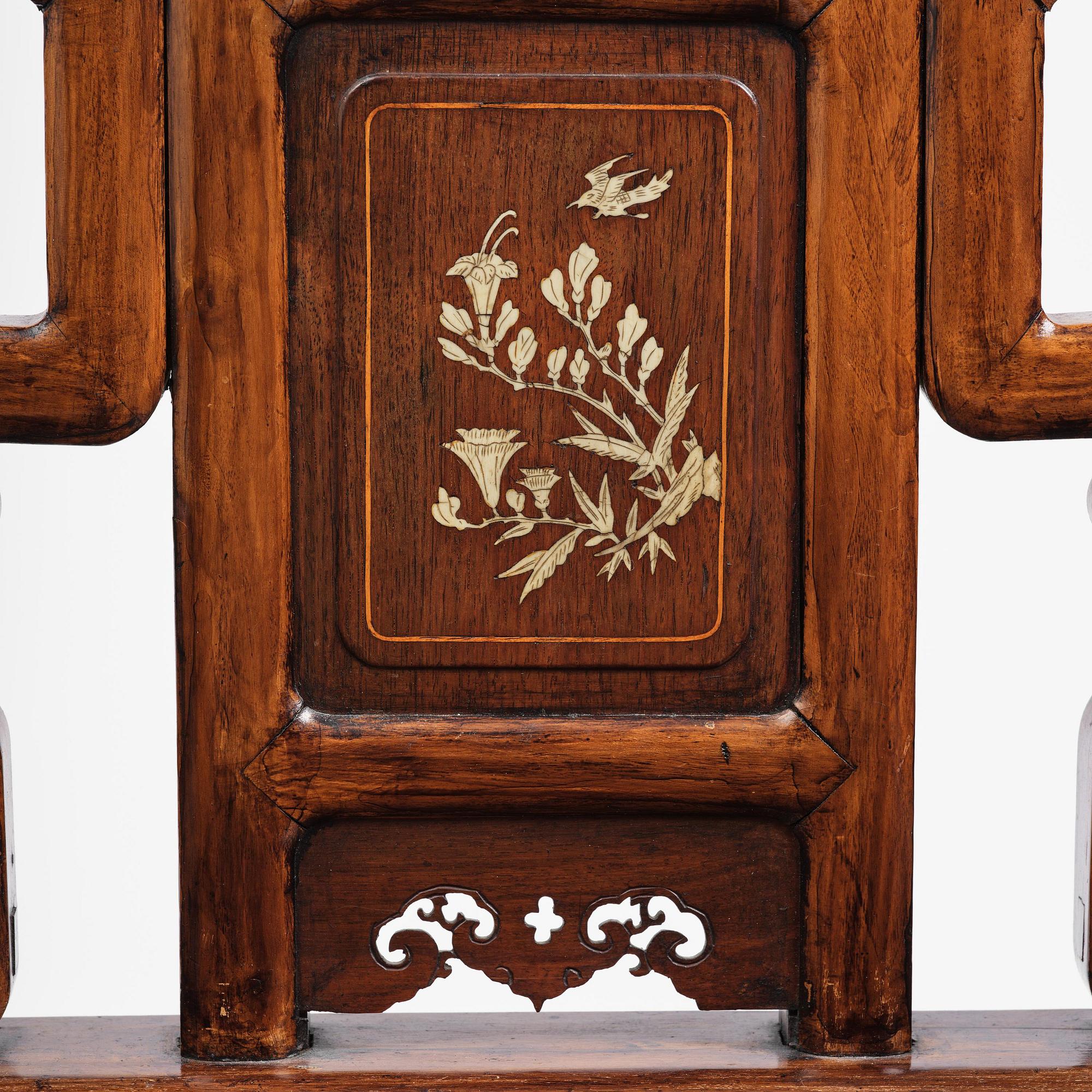 A pair of hardwood armchairs, late Qing dynasty.