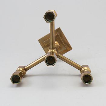 a brass candelstick from Gusum, 20th century.