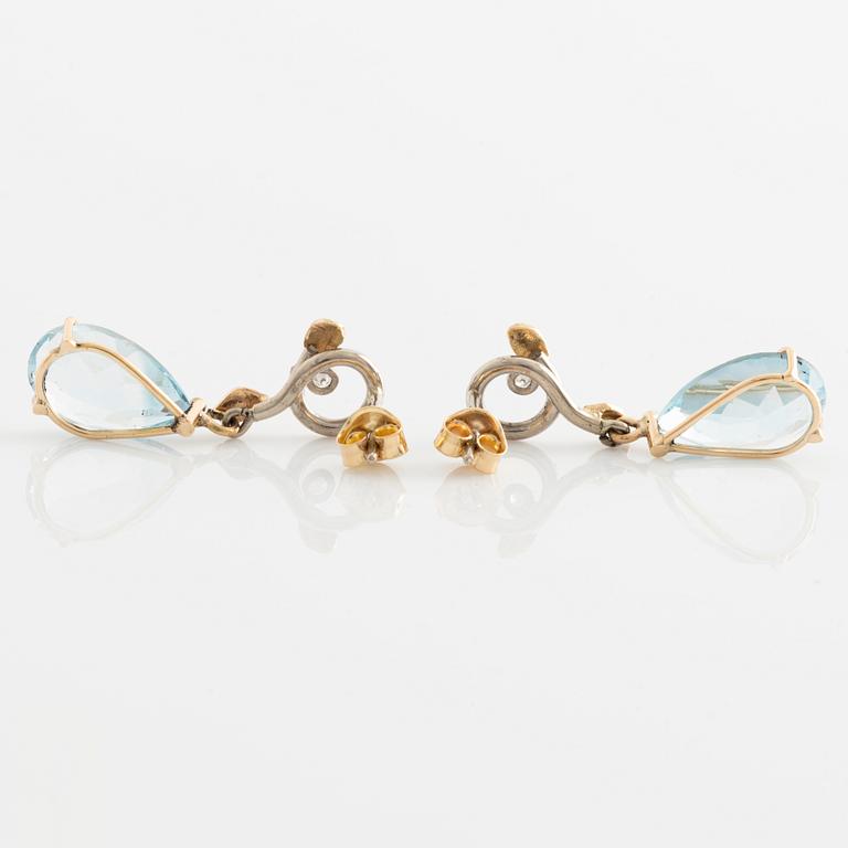 Earrings with pear-shaped topazes and brilliant-cut diamonds.