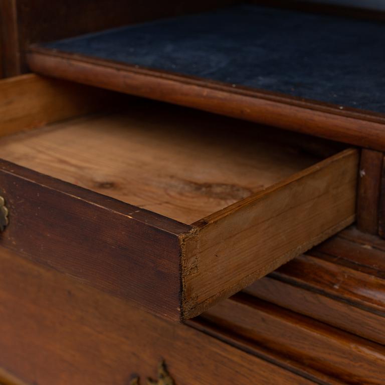 A mid 18th century rococo oak cabinet.