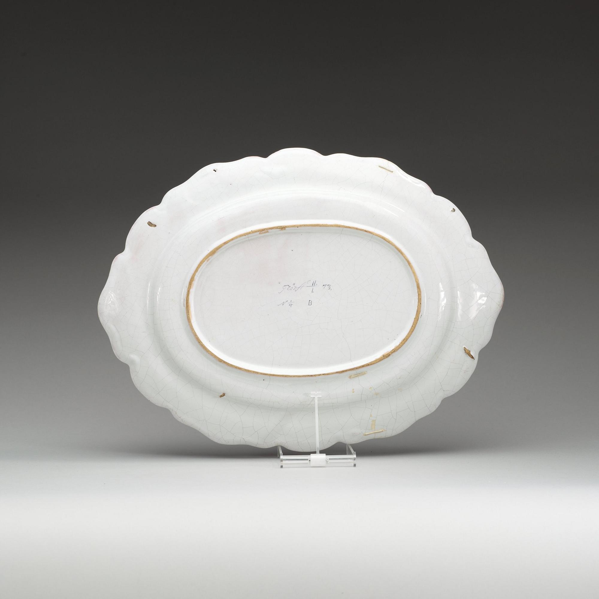 A Swedish Rörstrand faience charger, dated 11/1 (17)73.