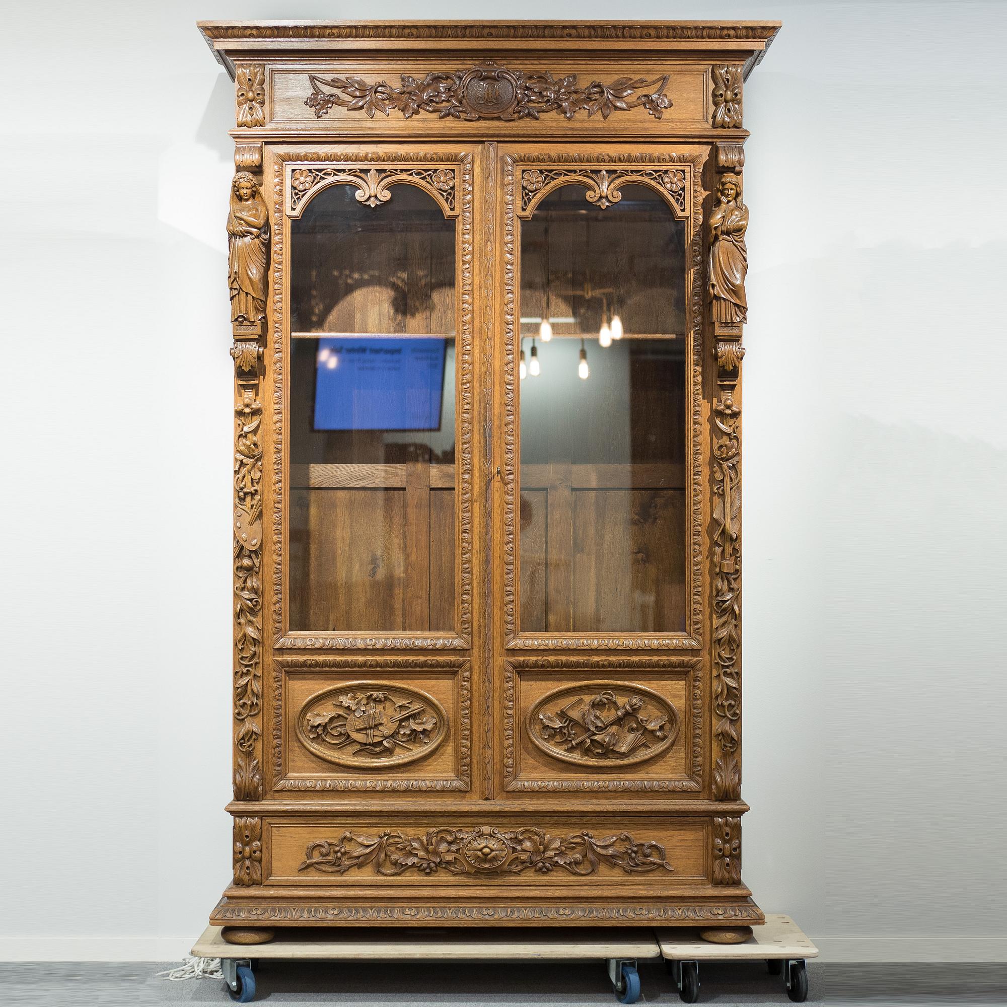 a oak vitrine cabinet from the late 1800's.