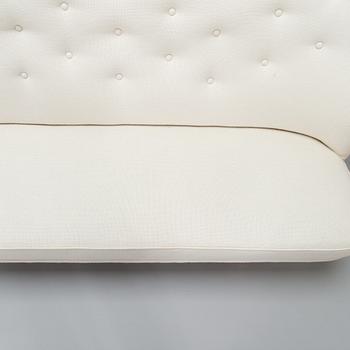 Ilmari Tapiovaara, a 1949 sofa for Keravan Puuteollisuus.