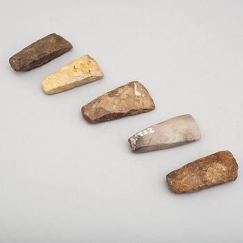 Five neolithic flint axes.