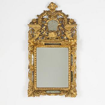 A South German Baroque carved giltwood mirror, early 18th century.