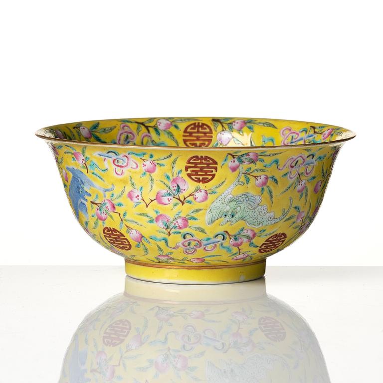 A yellow glazed 'nine bats and peaches' bowl, late Qing dynasty with Guangxu mark.