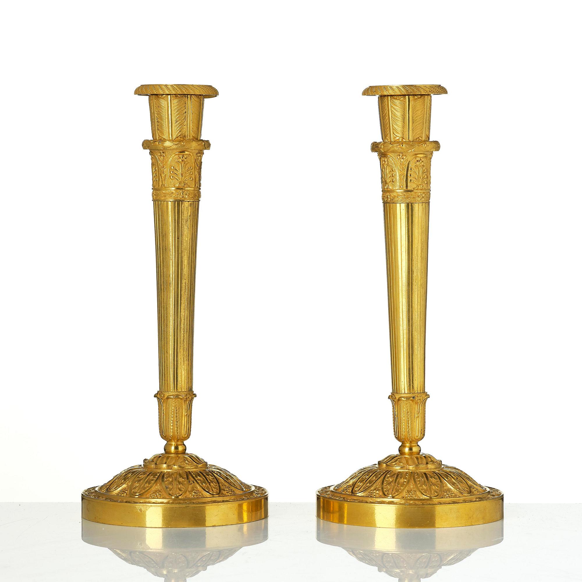 A pair of Empire ormolu candlesticks.
