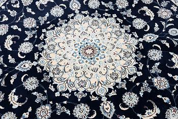 A Nain rug, diameter 243 cm.