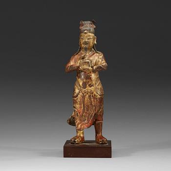 469. A gilt bronze figure of a High Daoist official, Ming dynasty.