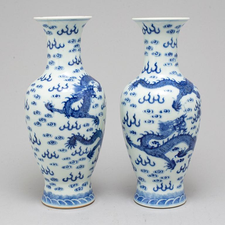 A pair of Chinese blue and white dragon vases, early 20th century, with a Qianlong mark.