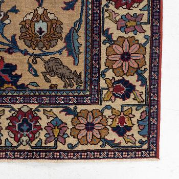 A semi-antique Tabriz of  'Sickle-Leaf' design, c 240 x 161 cm.