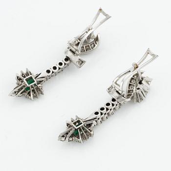 Earrings, 14K white gold with emeralds and brilliant- and octagon-cut diamonds.