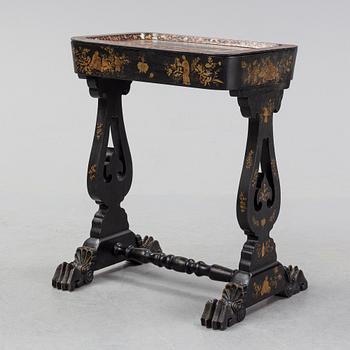 A black chinoiserie sewing table, second half of the 19th Century.