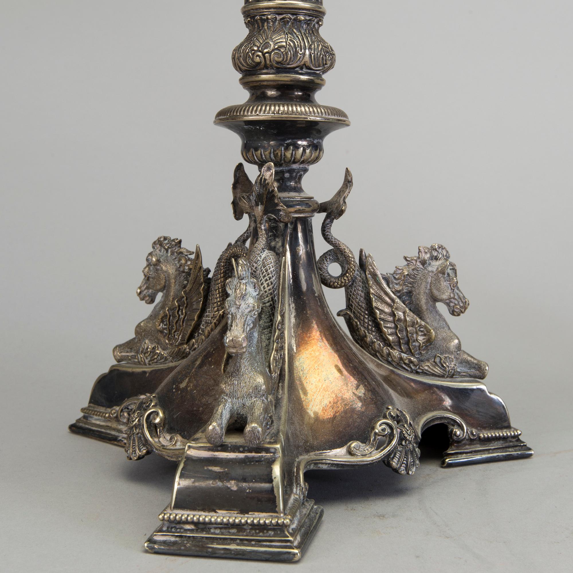A pair of late 19th century silver plated kandelabras by Henry Wilkinson & Co Ltd, Sheffield, England.
