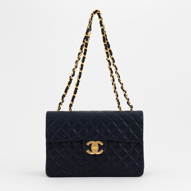 Chanel a black leather and gold hardware 'Maxi flapbag', 1991-1994.