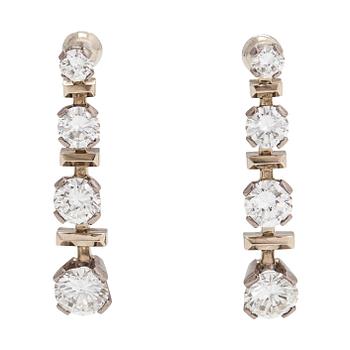 A pair of 18K white gold earrings, set with brilliant-cut diamonds totalling approx. 5.92 ct. Westerback, Helsinki 1973.