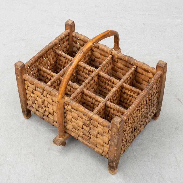 A 19th century wine bottle basket.