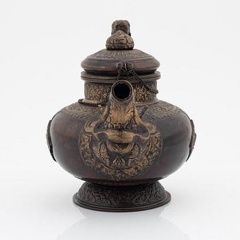 A Tibetan brass/copper teapot, circa 1900.