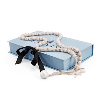 513. LANVIN, Paris, "Ribbon necklace" with whitw decorative pearls and silk ribbon.