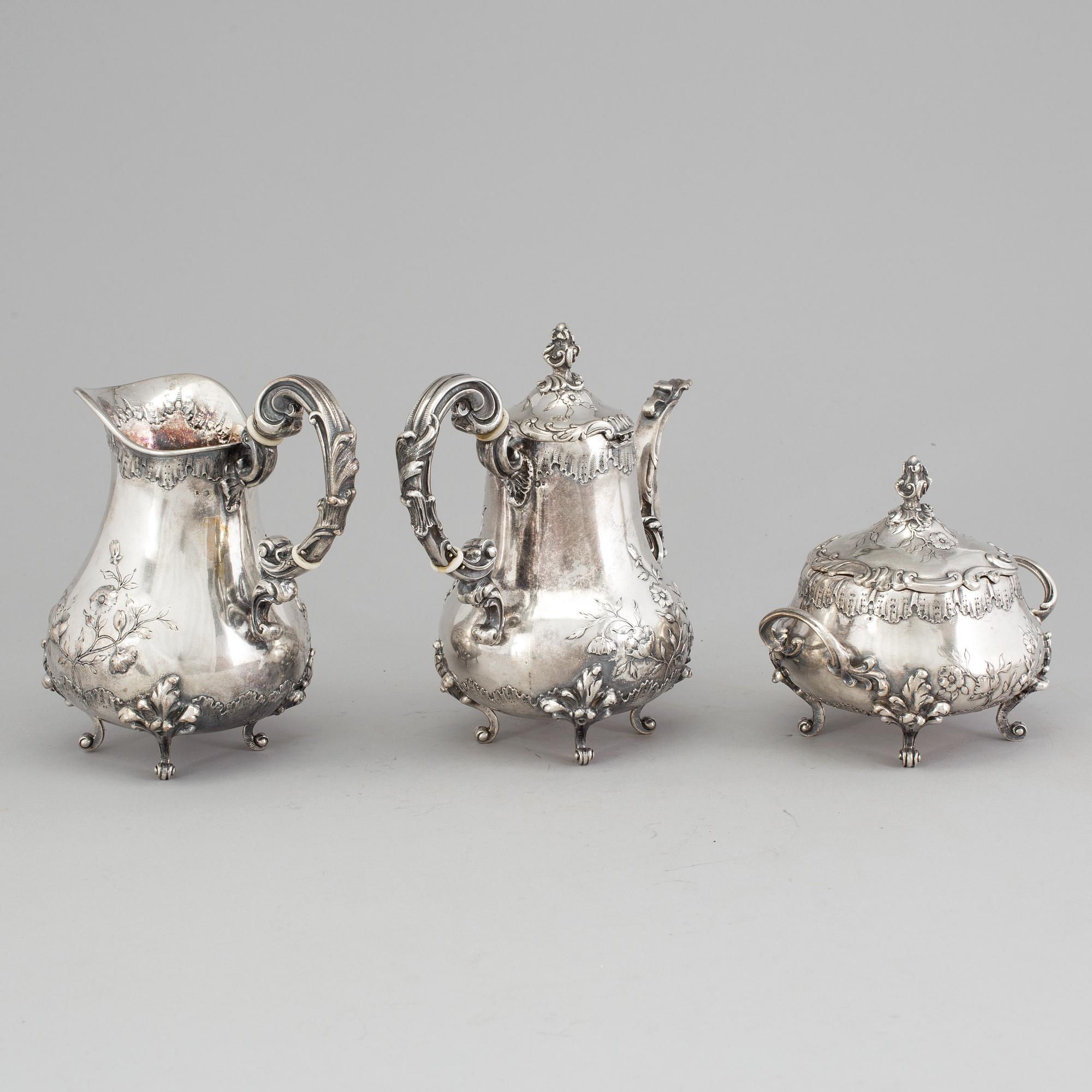 A SILVER COFFEEPOT, SUGARBOWL AND SIMILAR JUG, Hungary-Austria, ca 1900. Weight ca 1327 g.