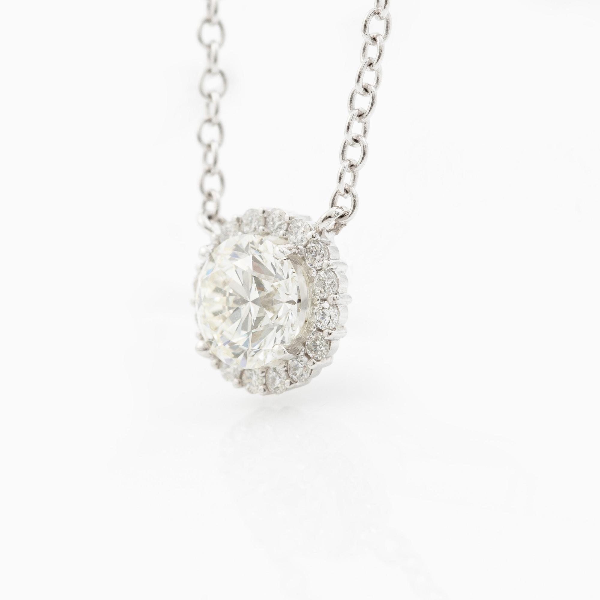 Collier 18K vitguld med briljantslipad diamant.