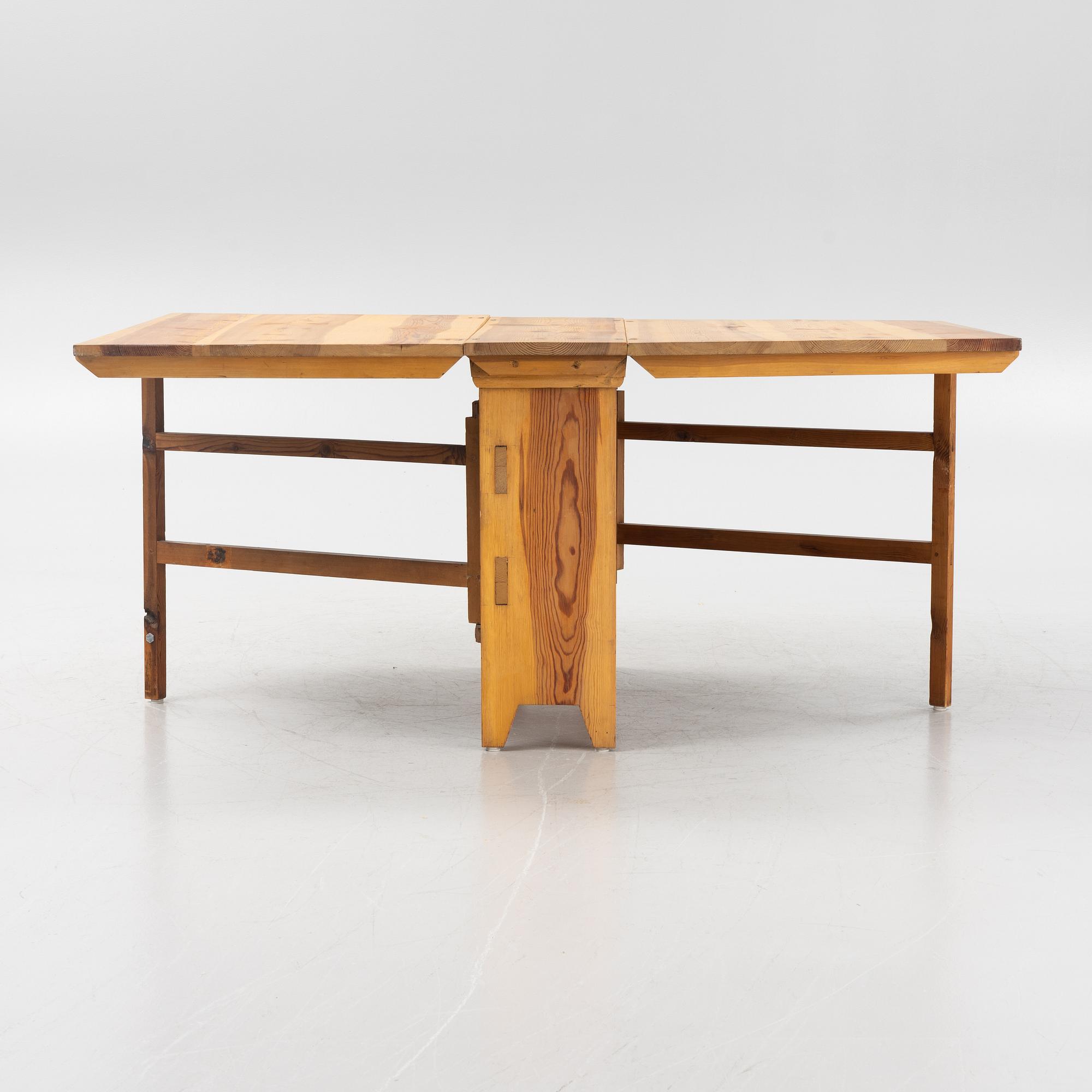 A pine gateleg table, 19th Century.