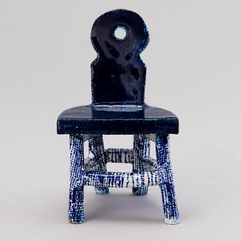 HEINI RIITAHUHTA, a porcelain miniature sculpture 'Chair' signed Heini Riitahuhta.