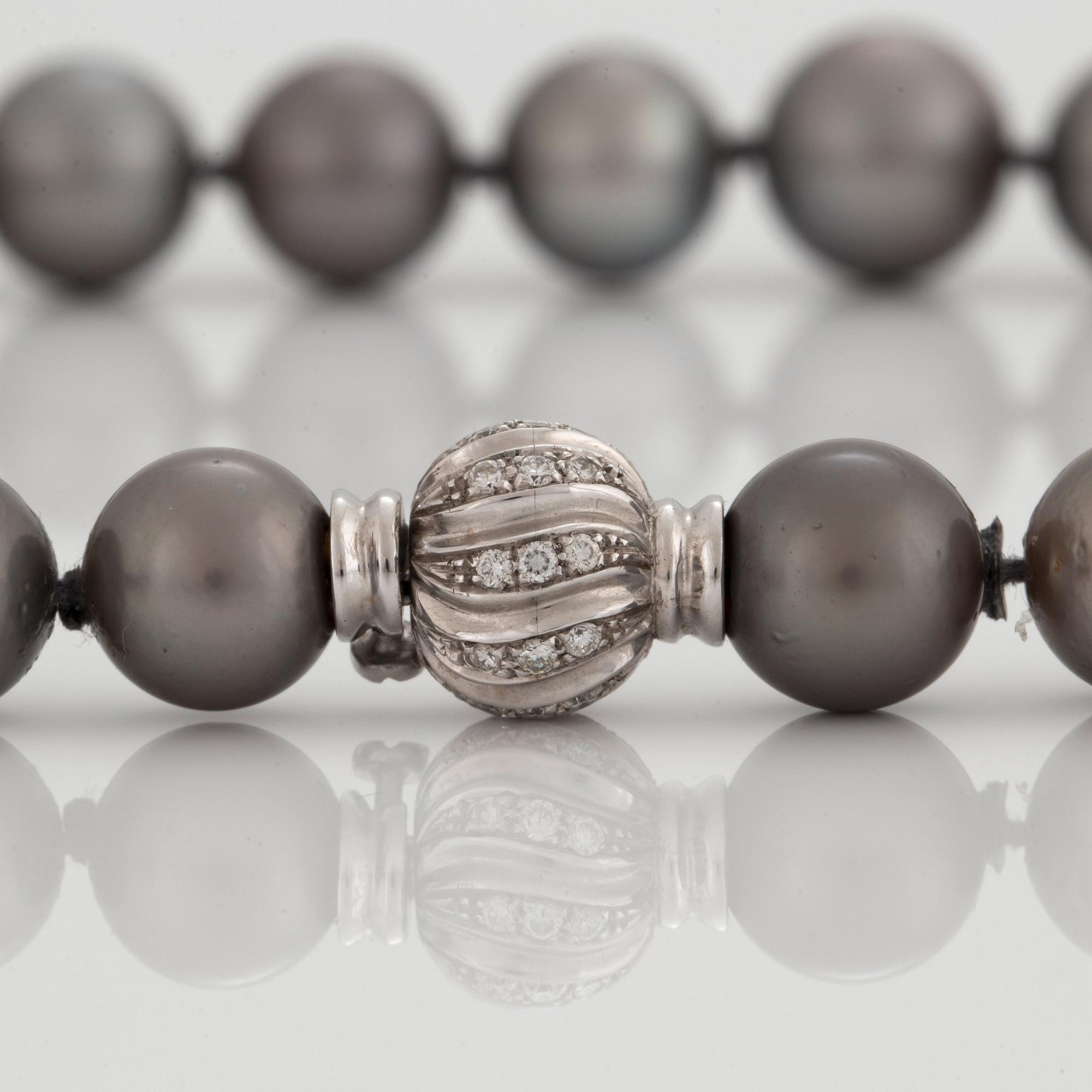 A NECKLACE of cultured Tahiti pearls.