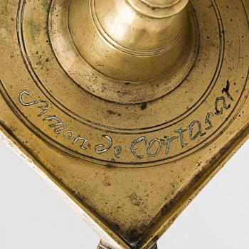 A late 17th century Spanish brass candlestick.