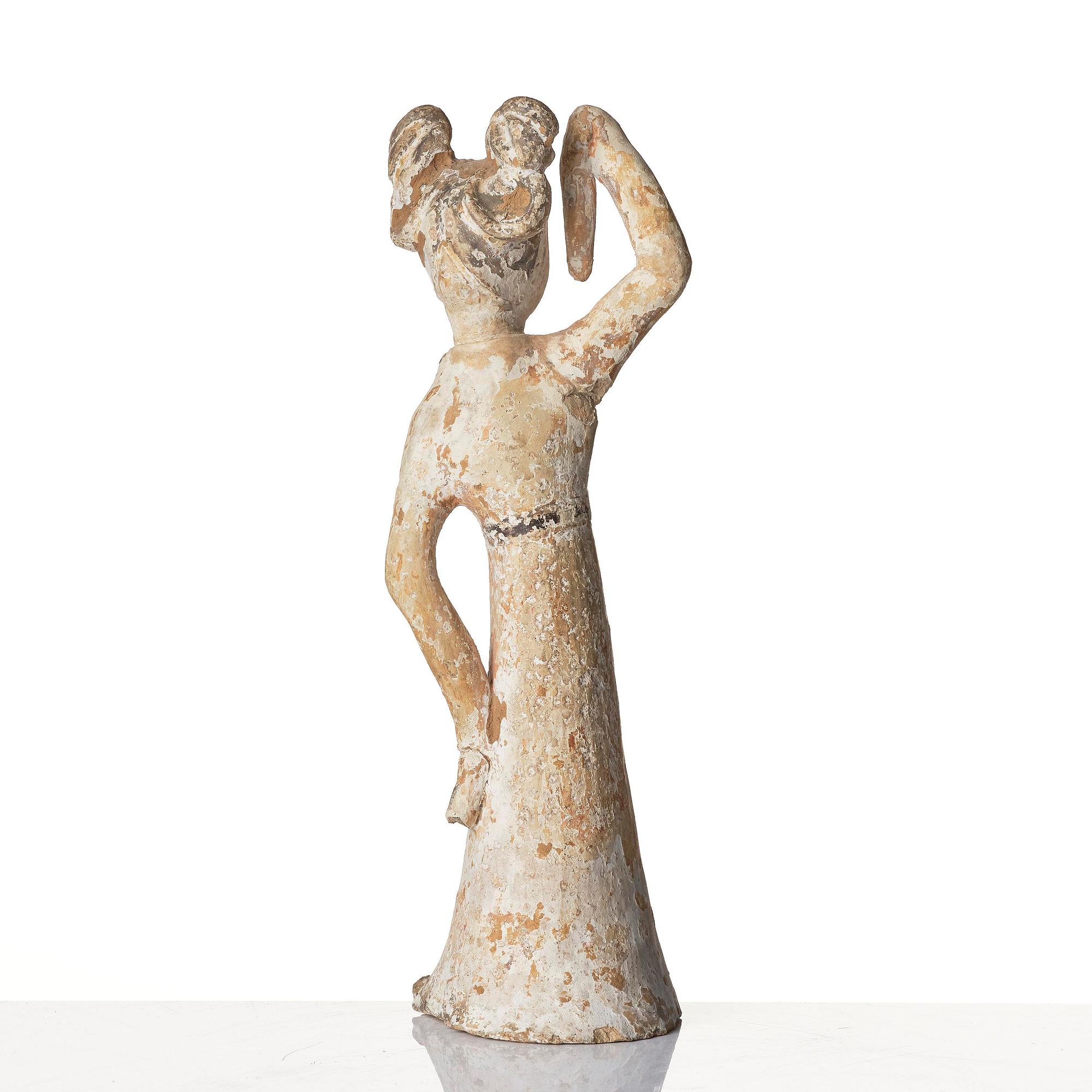 A painted pottery figure of a female dancer, Tang dynasty (608-906).