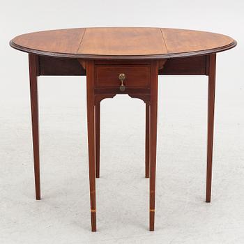 A drop-leaf table, England, early 20th Century.