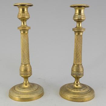 A pair of 'Empire' candlesticks, probably French.