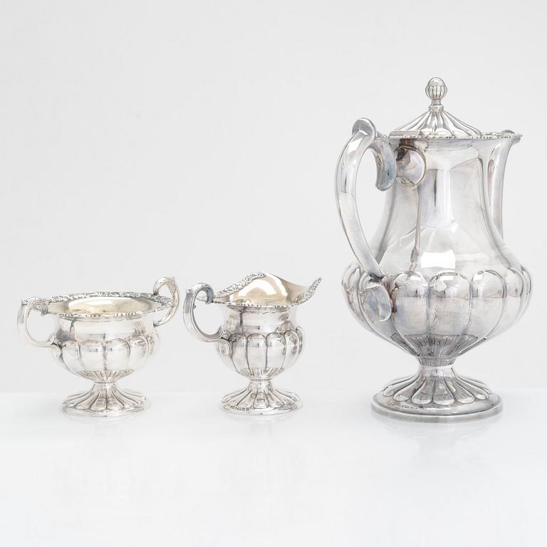 Silver sugar tongs, Herman Wist, Uusikirkko, Carelia 1928, a 3-piece coffee service, a candlestick pair, Finland 1950s.