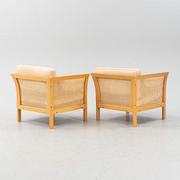 A pair of 'Rotan' easy chairs by Arne Norell, end of the 20th Century.