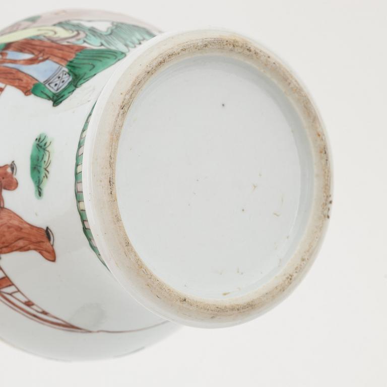 A Chinese dinner plate and a Japanese imari bowl, 18th Century together with a Chinese 19th Century jar with cover.