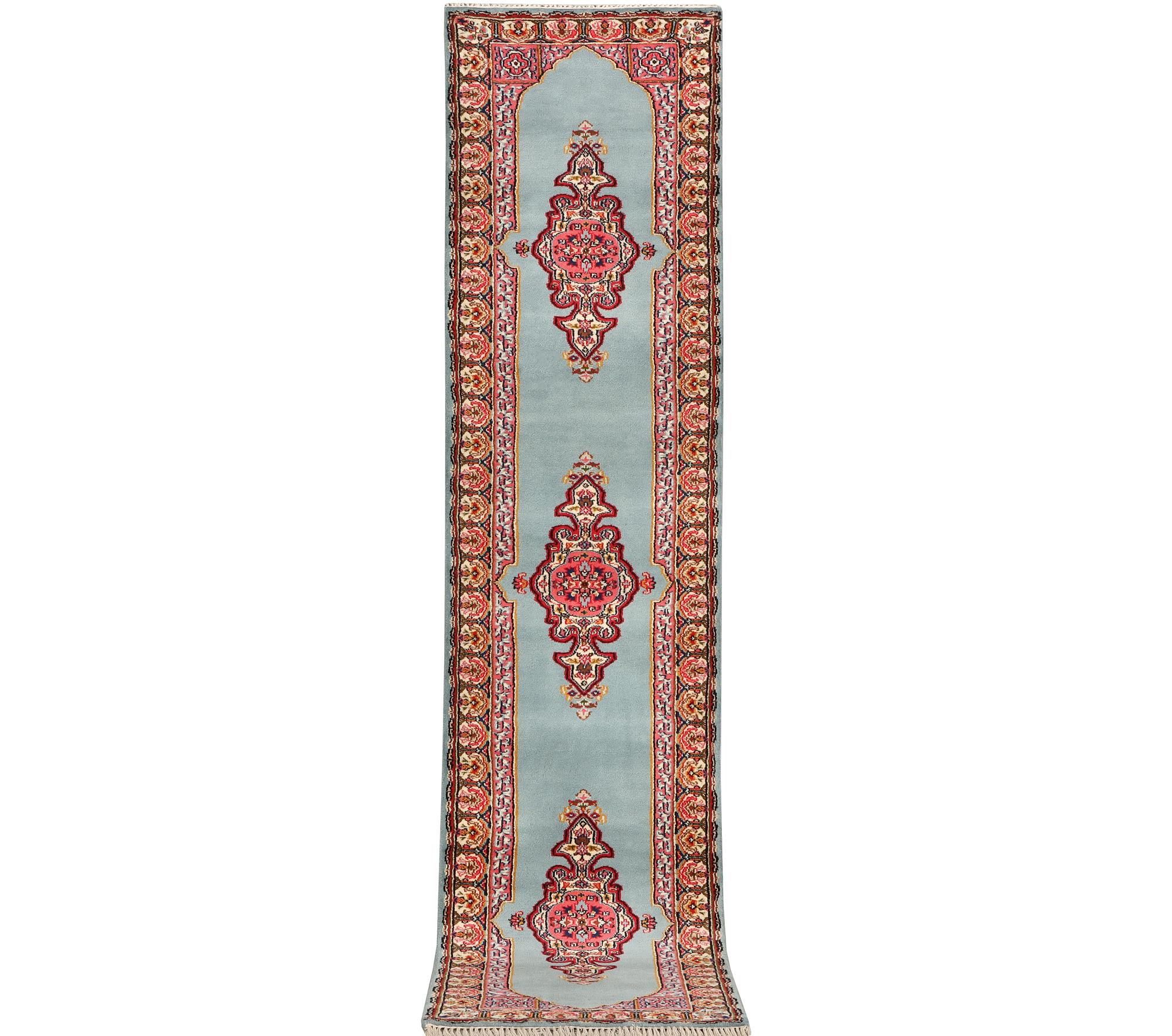 An oriental runner, c. 550 x 74 cm.