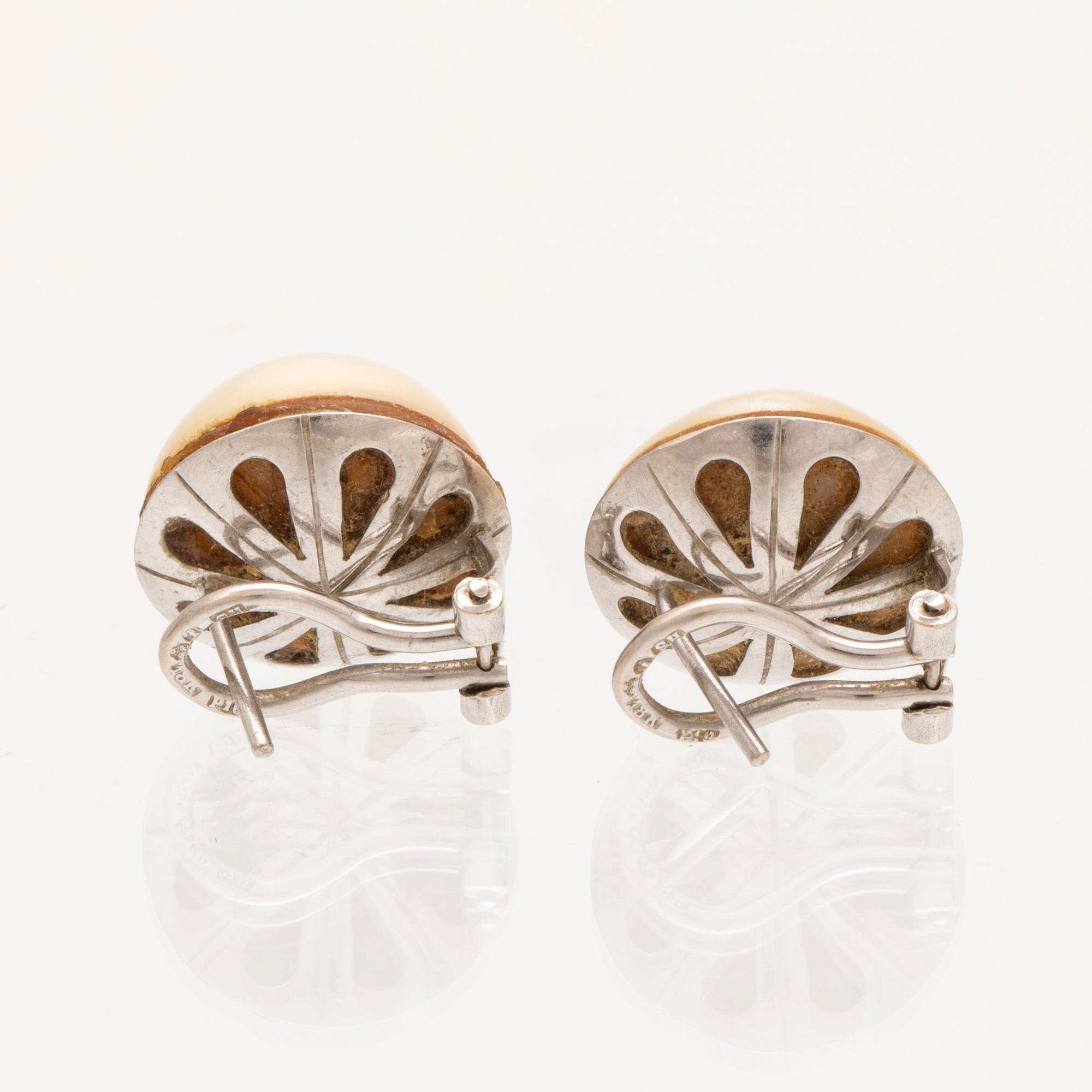 A pair of 18K white gold earrings set with Mabe pearls, Hans Strömdahl Stockholm 1989.