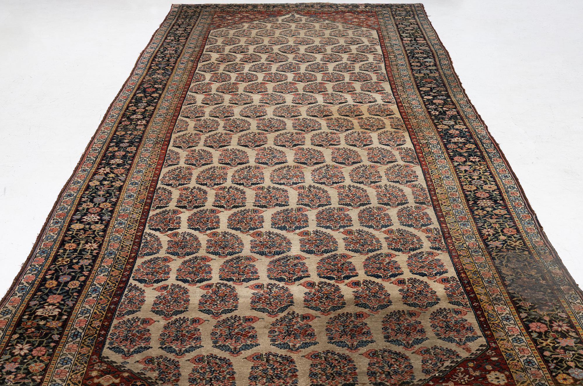 A Bakhtiari carpet, signed, c. 580 x 212 cm.