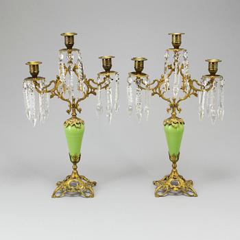A pair of late 19th Century gilt candelabra.