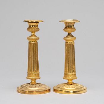 A pair of Empire-style candlesticks, ca 1900.