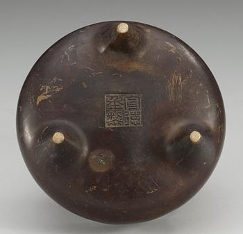 A bronze tripod censer, Qing dynasty (1644-1912) with archaistic seal mark.